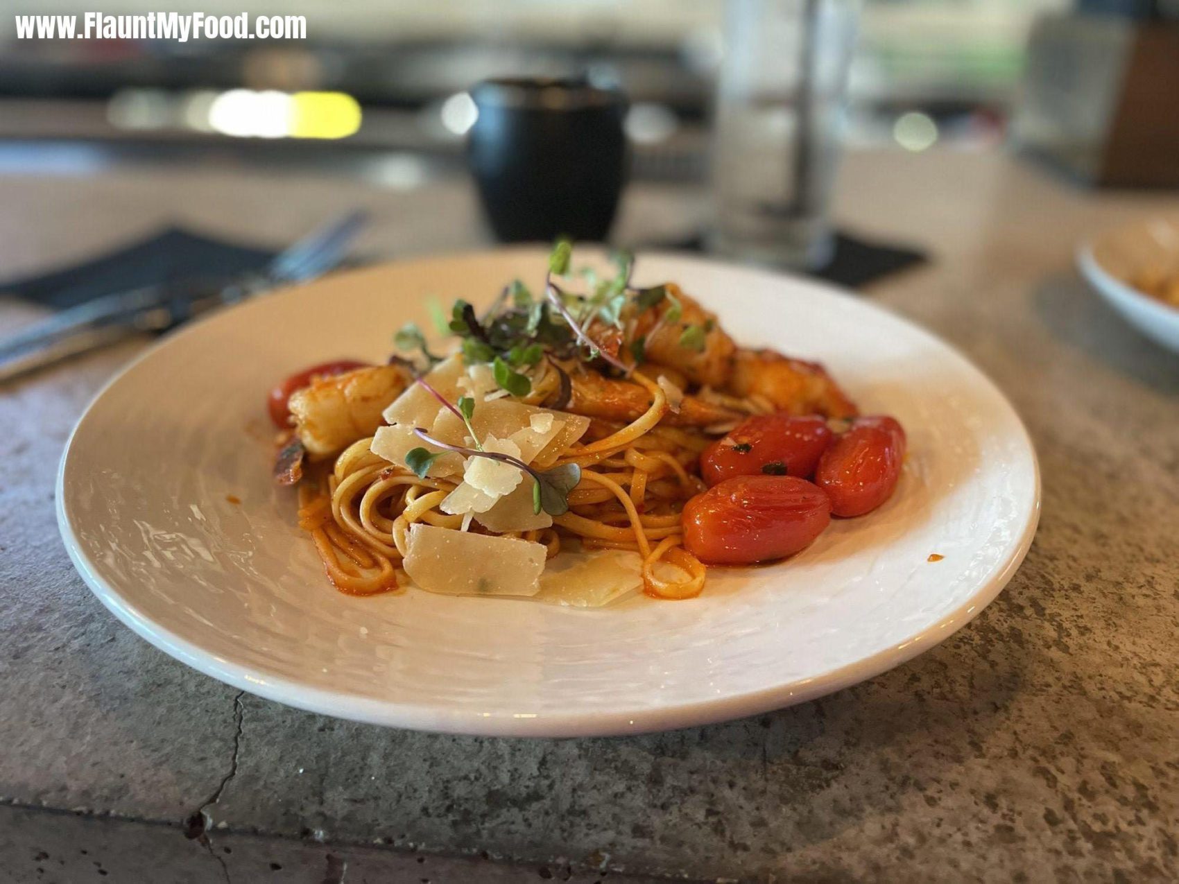 Wishbone & Flynt in Fort WorthShrimp Fra Diavolo. And a spicy pasta with tomatoes on the side great presentation. Wishbone & Flynt Is located on Bryan street in downtown Fort Worth Texas.