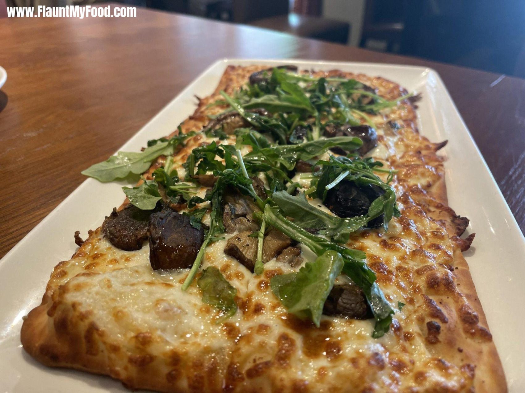 Del Friscos Grille Fort WorthWILD MUSHROOM FLATBREAD Fontina, Caramelized Onions, Baby Arugula, White Truffle Oil. Portobello mushroom and arugula flat bread pizza at Del Friscos Grille Fort Worth.