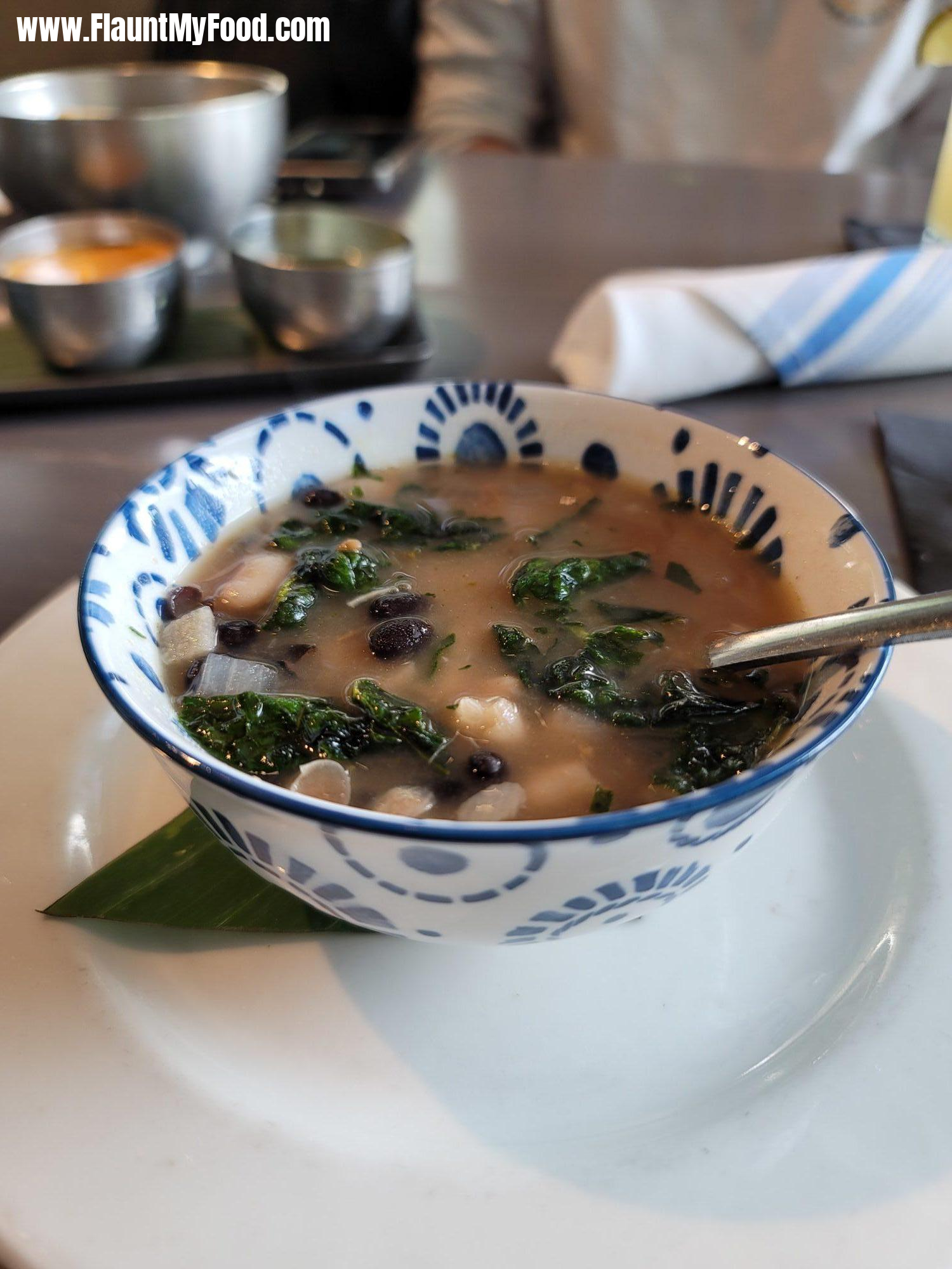 De La Olla Soup at Miriam Cocina Latina - Dallas, TXDe La Olla Soup at Miriam Cocina Latina in Uptown Dallas with white and black beans, tomatoes, cilantro, topped with crispy spinach.