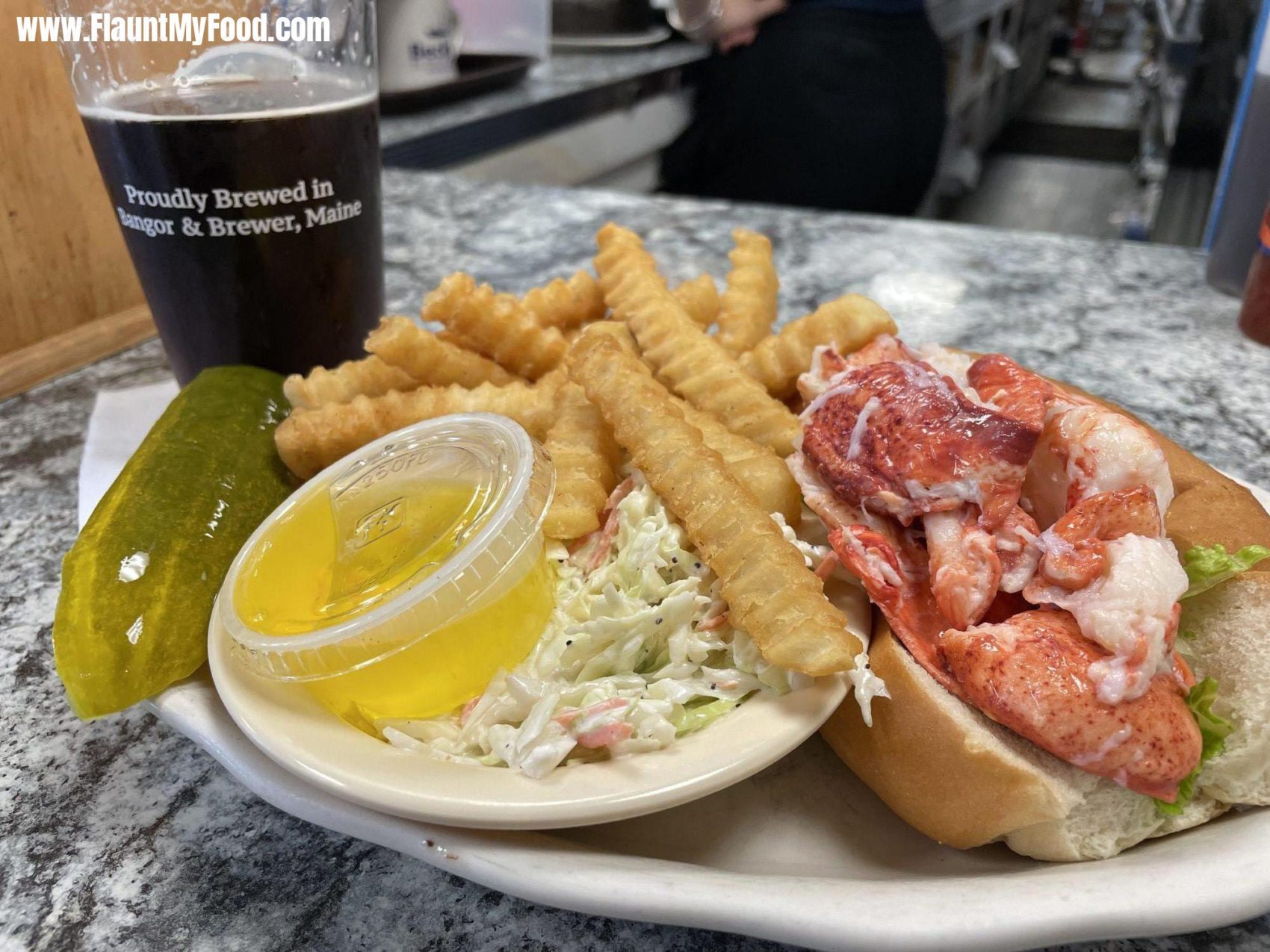 Lobster Roll at Beckys Diner on Hobson Wharf in Portland MaineLobster Roll at Beckys Diner on Hobson Wharf in Portland Maine. 1/3 pound of fresh picked Maine lobster meat and shredded lettuce with mayo and melted butter served with french fries and coleslaw. Also ordered a local beer on tap call Geaghan Brothers Brown Ale.