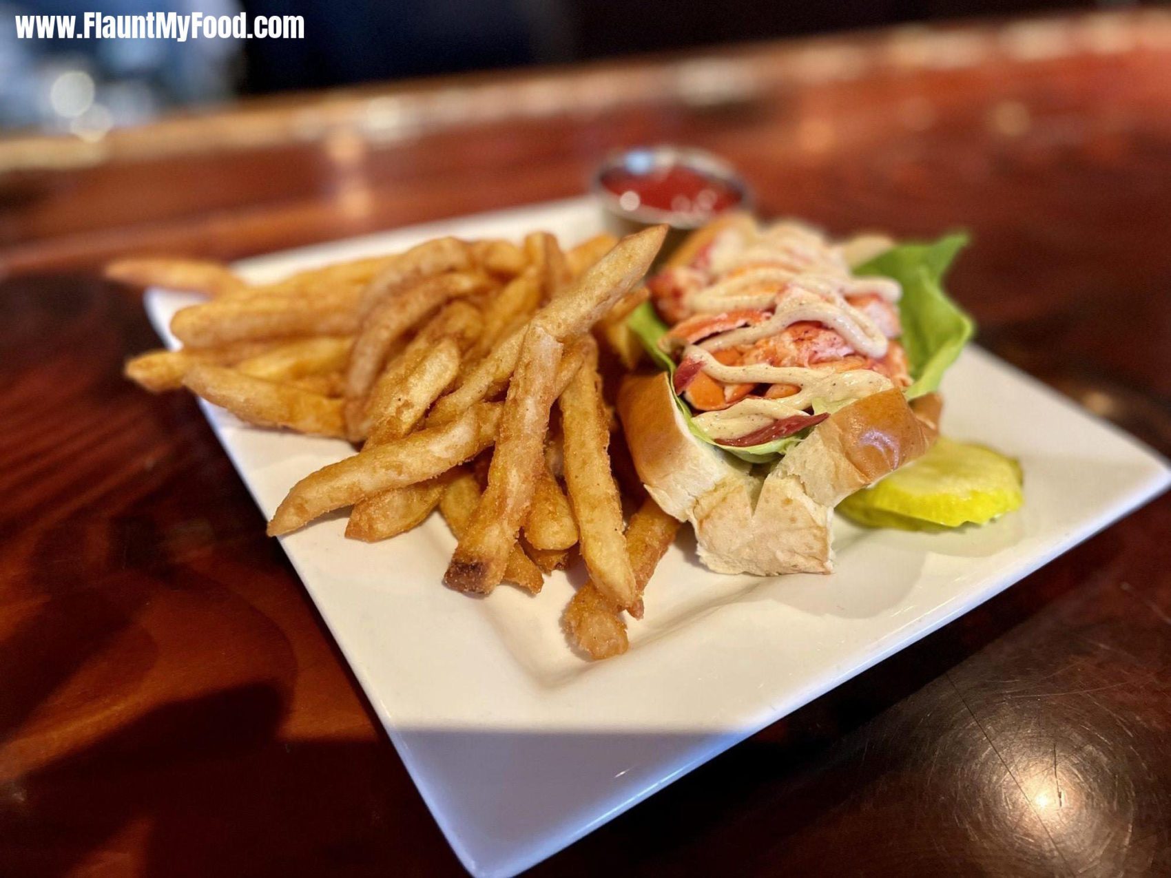 Lobster roll with french fries at DiMillo’s Portland Maine