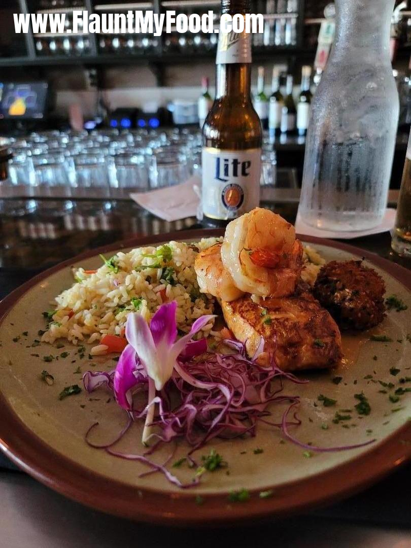 Lili's Bistro on MagnoliaLili's Seafood Trio with Thai chile-glazed salmon, 2 apricot-glazed prawns, and one crab cake served with Lili\'s Rice.