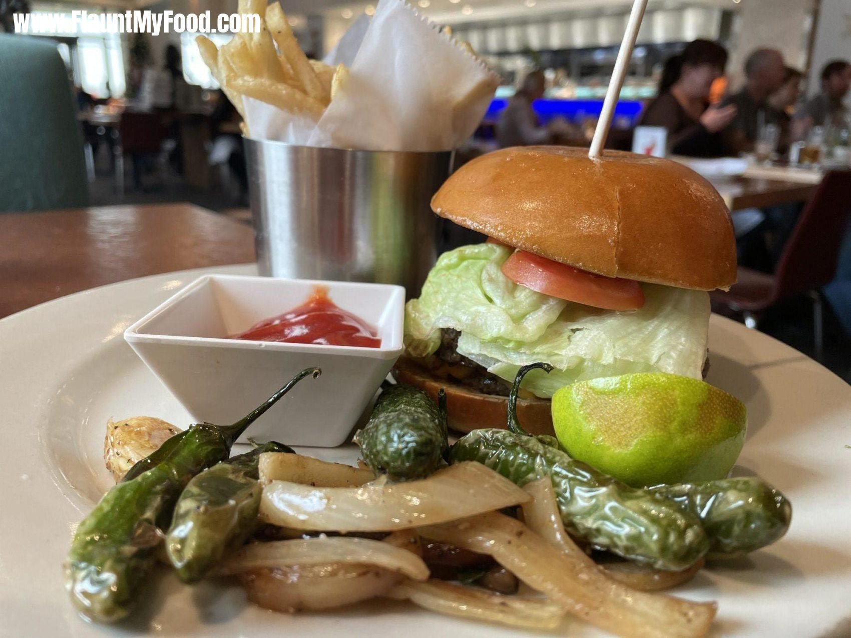 Mesero Rose burger with french fries and grilled jalapeños on the side in clear Fork in Fort Worth Texas