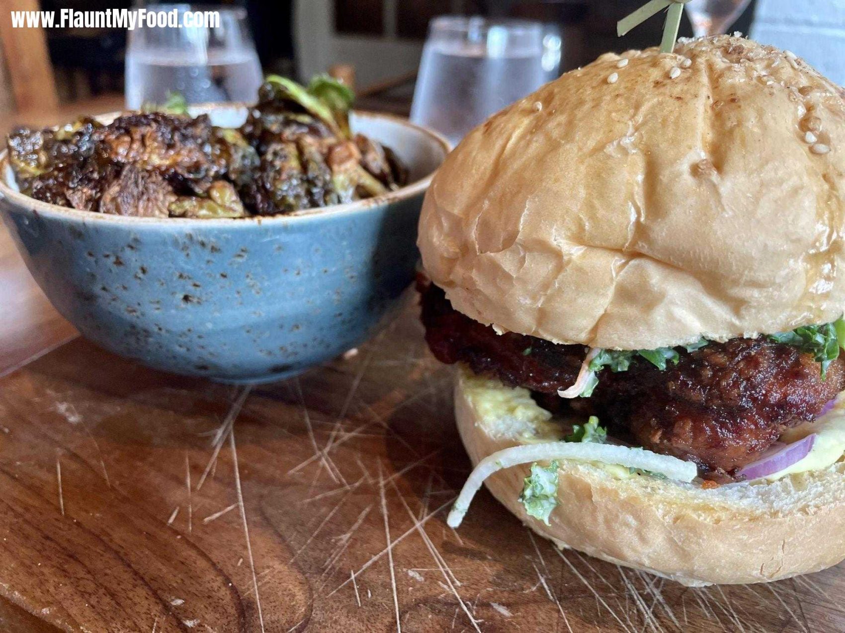 Chicken burger and Brussel sprouts at the Fixe restaurant in Clearfork in Fort Worth TexasChicken burger and Brussel sprouts at the Fixe restaurant in Clearfork in Fort Worth Texas