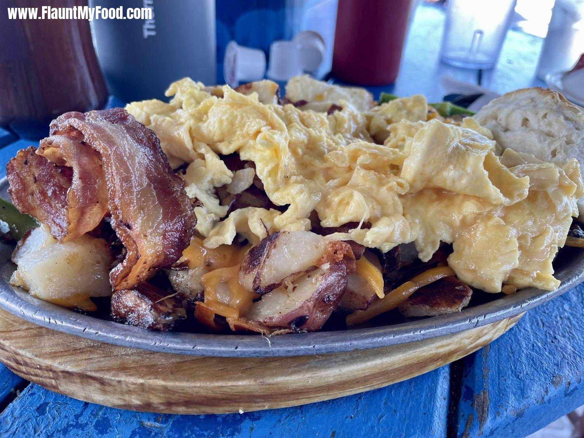 Bacon egg and potato skillet with a biscuit at the gulf of drive café on Anna Maria Island Florida