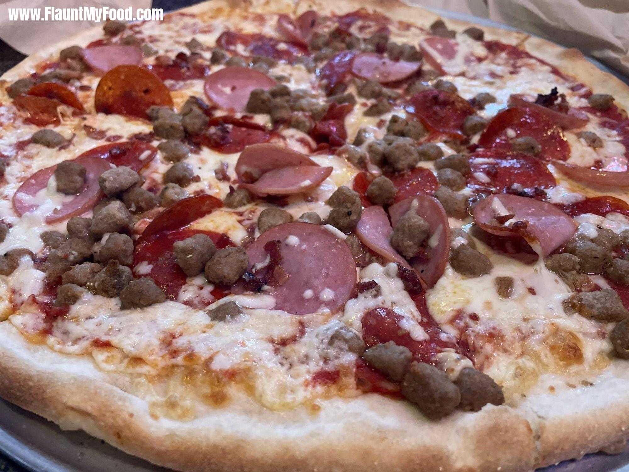 Meat lover pizza with sausage pepperonis cheese at Joe’s pasta and pizza on Hulen in Fort Worth