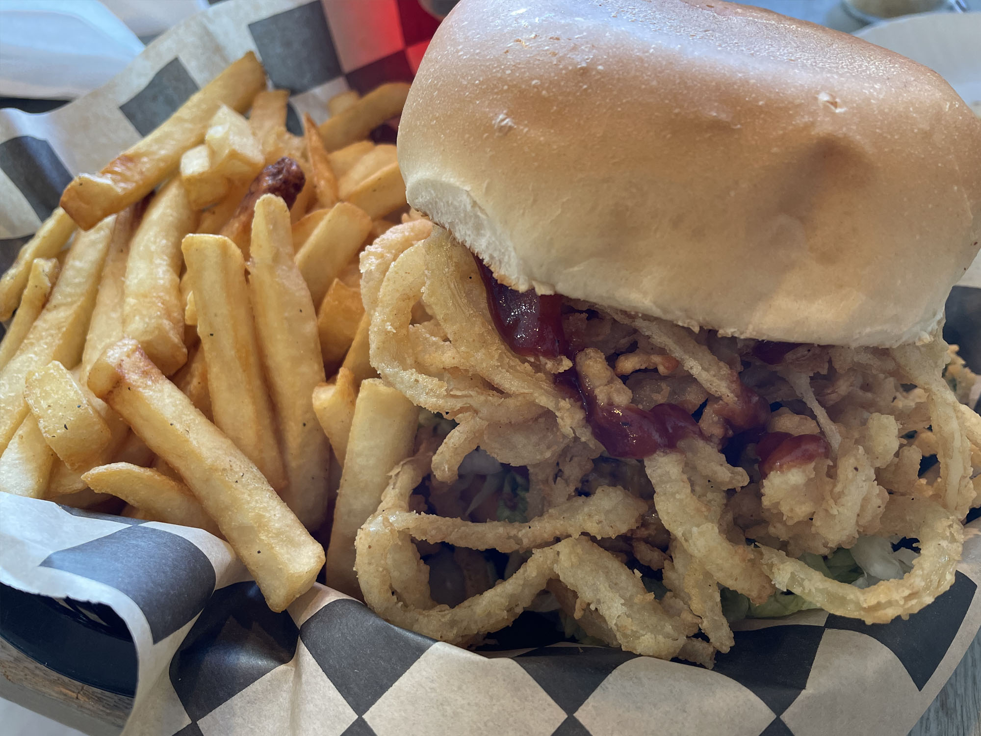 Beach Burger at Way West Grill, Galveston TexasSavor the ultimate taste of summer with the Beach Burger at Way West Grill and Pizzeria in Galveston, Texas. Our mouthwatering burger features a juicy beef patty topped with crispy bacon, spicy jalapeños, and a sweet and savory bacon jam, all drizzled with tangy barbecue sauce. Whether you're looking for a hearty lunch, a satisfying dinner, or a delicious snack to enjoy by the beach, the Beach Burger is the perfect choice. Pair it with our crispy fries or a refreshing drink, and indulge in the flavors of the Gulf Coast. At Way West Grill and Pizzeria, we pride ourselves on using only the freshest ingredients and preparing our dishes with care and attention to detail. Join us for a great meal and a great time in our laid-back and friendly atmosphere. Order your Beach Burger today and experience the taste of Galveston!