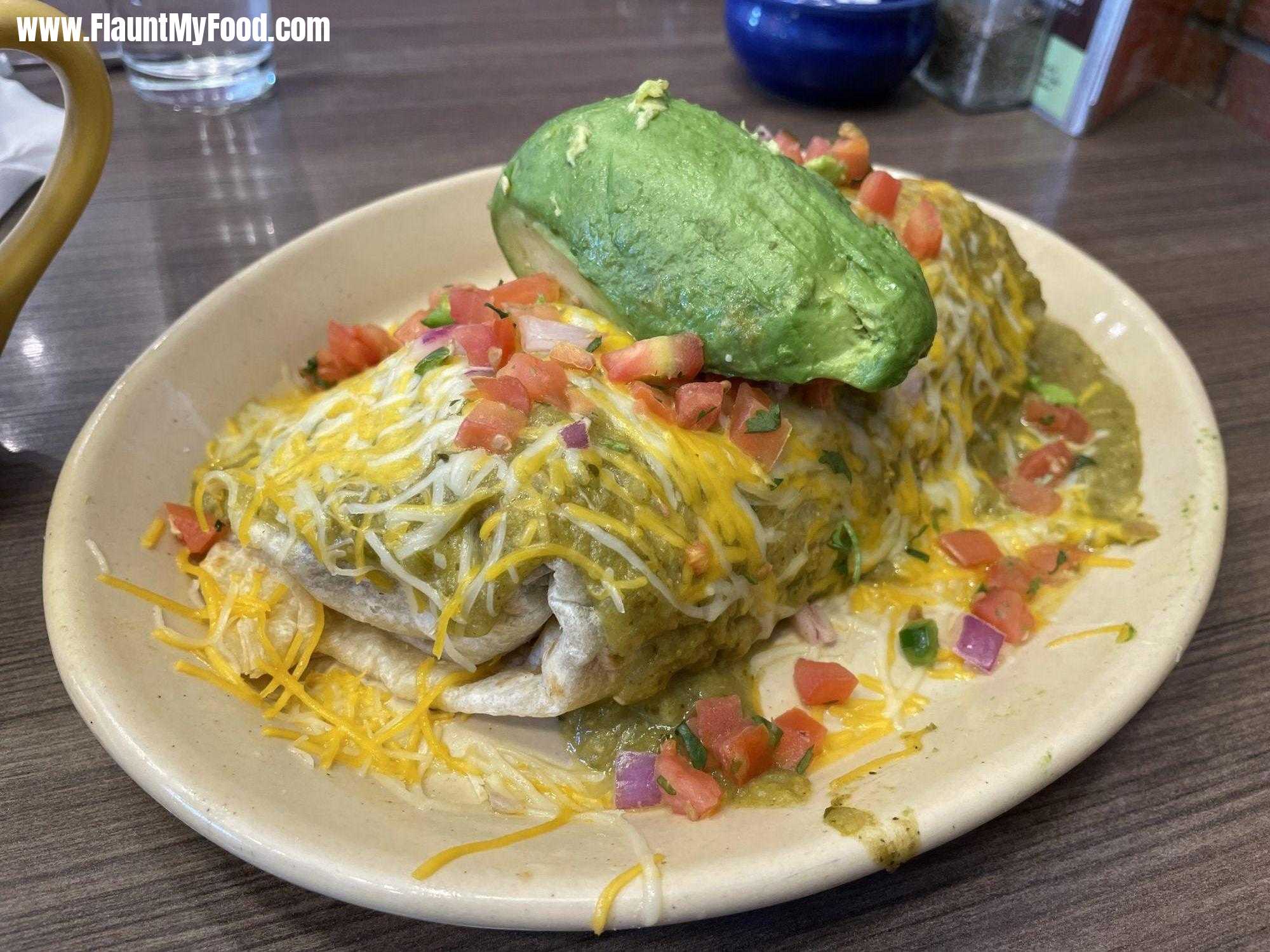 Burrito at Snooze Eatery Fort WorthLooking for a hearty breakfast that will keep you fueled all day? Look no further than the giant burrito at Snooze Eatery on W7th in Fort Worth, TX. This breakfast classic is loaded with all your favorites, including fluffy eggs, crispy hash browns, black beans, and melted cheese, all wrapped up in a warm tortilla and smothered in green salsa. Add your choice of extras, such as avocado or bacon, for an even more delicious meal. Don't forget to split this giant burrito with a friend, and share a plate of our famous french toast for a truly satisfying breakfast. At Snooze Eatery, we pride ourselves on using the freshest and most flavorful ingredients to create breakfast dishes that are both delicious and nutritious. Visit us on W7th in Fort Worth and experience our warm and welcoming atmosphere, friendly service, and exceptional food. Don't forget to try our famous pancake flights, benedicts, and other breakfast favorites, too! Reserve your table today and taste the best breakfast in town.