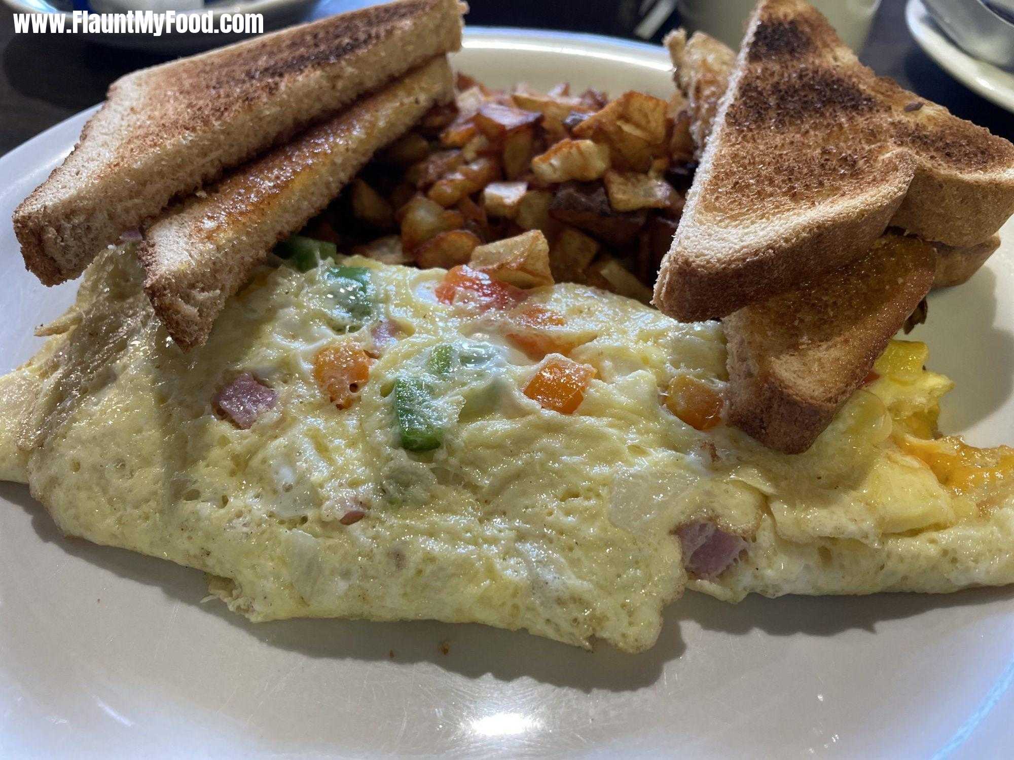 Uncle Sam's Pancake House, Manitou Springs Colorado Denver OmeletteUncle Sam's Pancake House, Manitou Springs Colorado Denver Omelette with wheat toast and home fries. A great breakfast area!