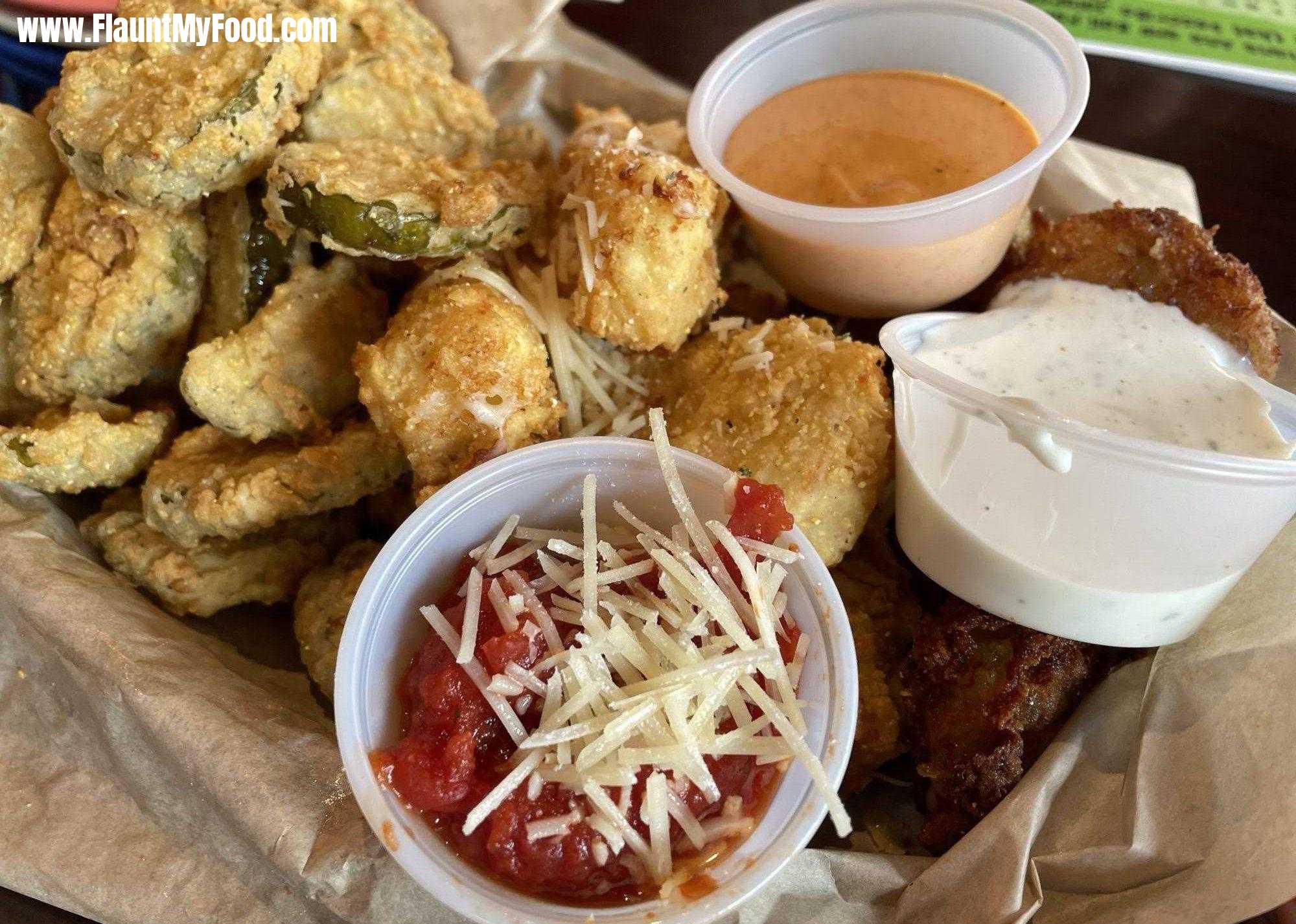 Border Burger in Manitou Springs ColoradoCOMBO PLATTER Hand-battered and golden brown fried pickles, breaded mozzarella, and cannon balls. Served with ranch, spicy aioli and marinara sauce.