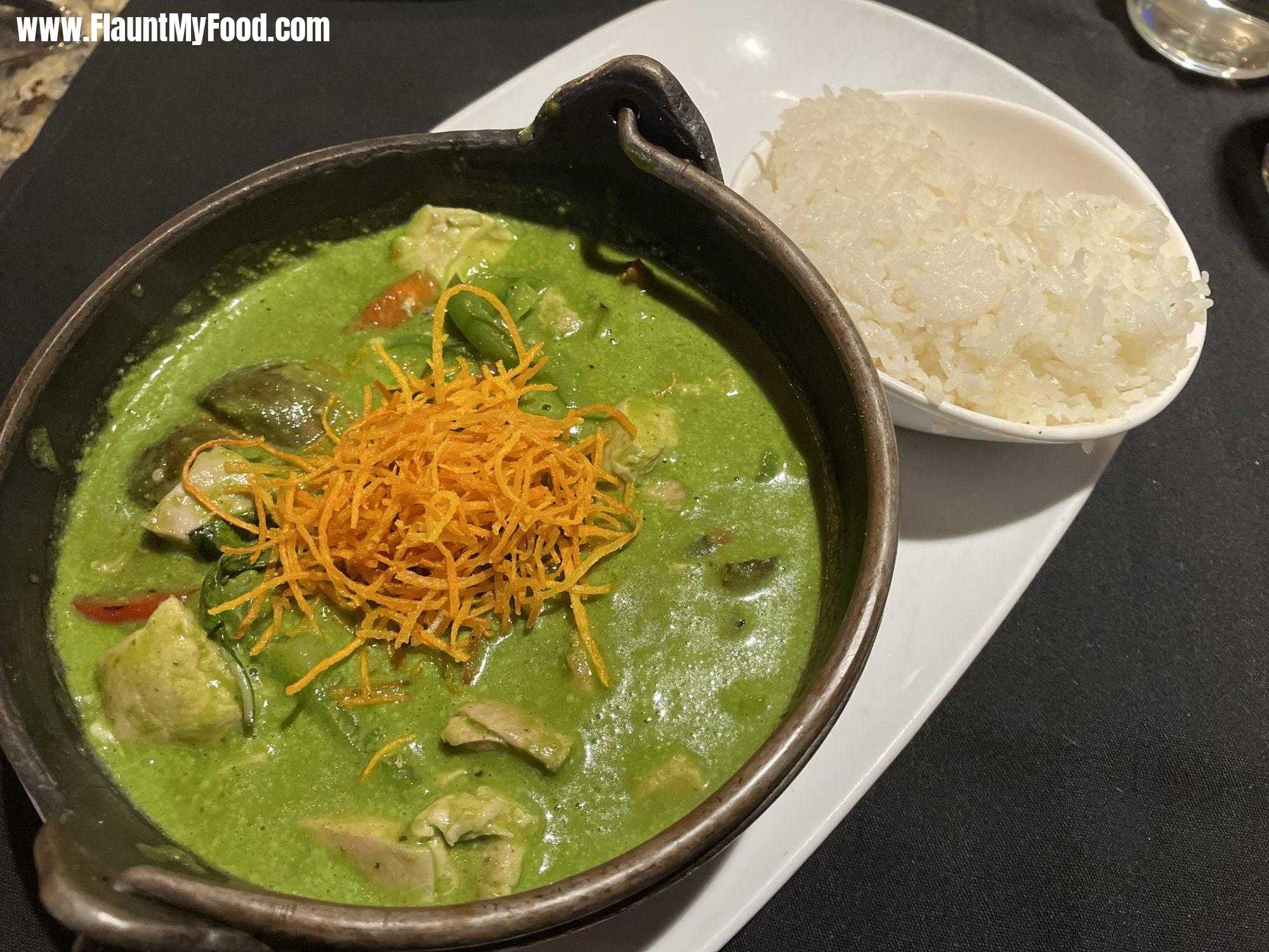 Iron pot, green curry, chickenMalai in Clearfork Fort Worth Texas. Scratch made green curry stew with chicken, Thai, eggplant, crispy carrots, and choice of jasmine rice, brown rice, or rice noodles on the side.