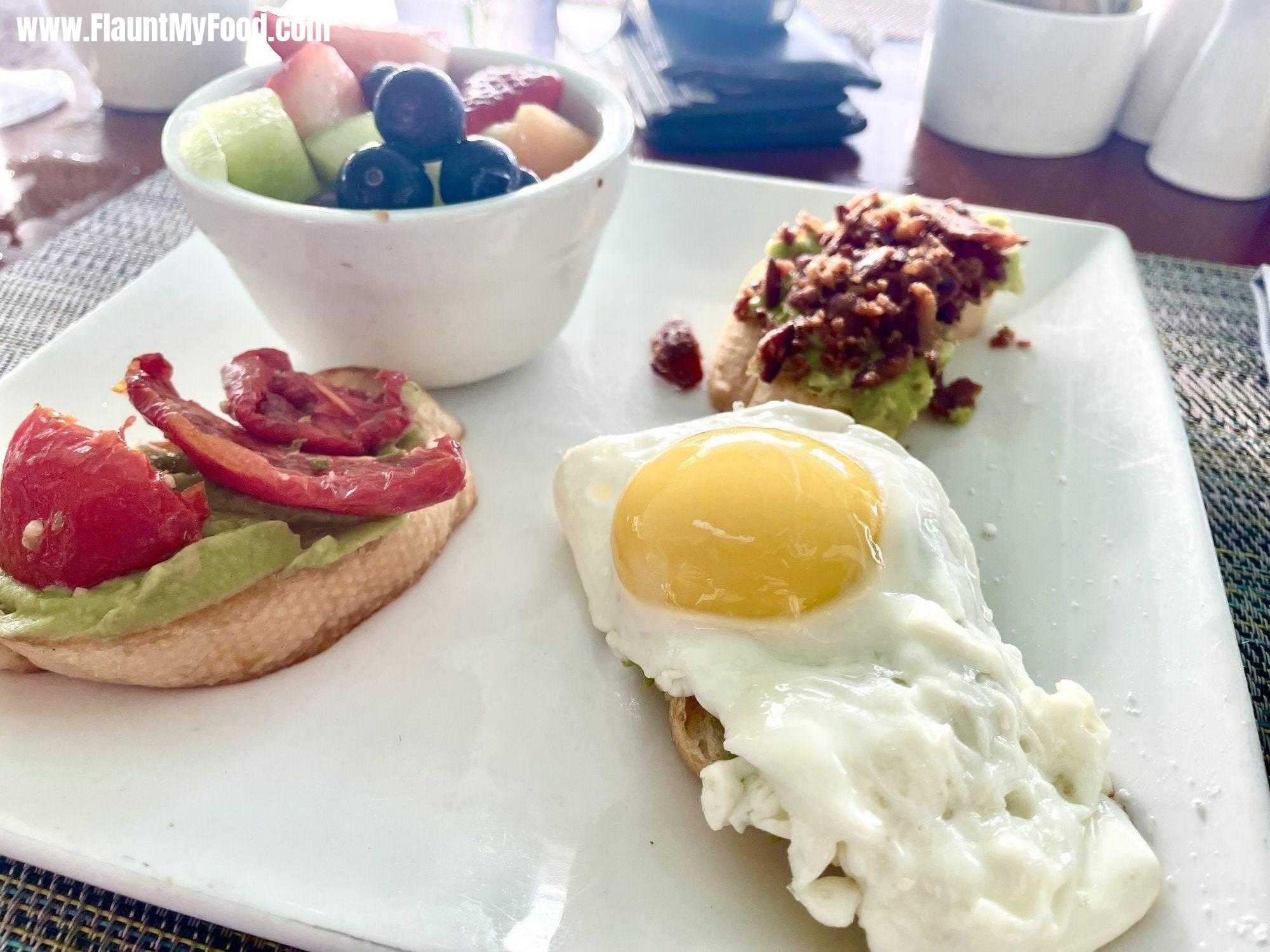 Southern Most Beach Resort Cafe, Key West FloridaAn amazing breakfast at Southern Most Beach Resort Cafe, Key West Florida. Avocado Trio - Multigrain Baguette, Avocado Mousse, Bacon, Roasted Tomatoes, Sunny Side up Egg with a Side of Fruit