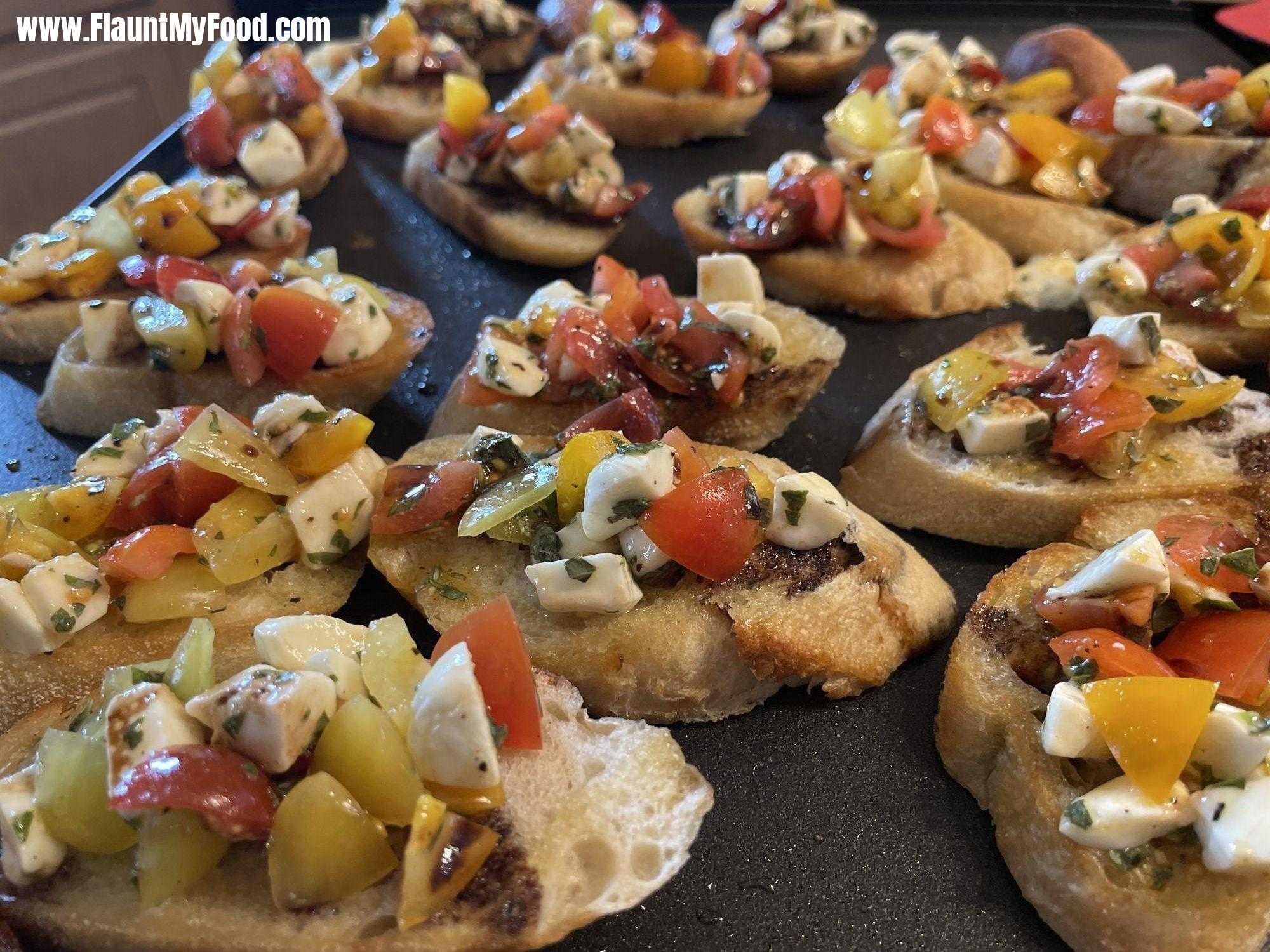 Bruschetta at homeSimple bruschetta at home with tomatoes, basil, and mozzarella finished with balsamic and evoo