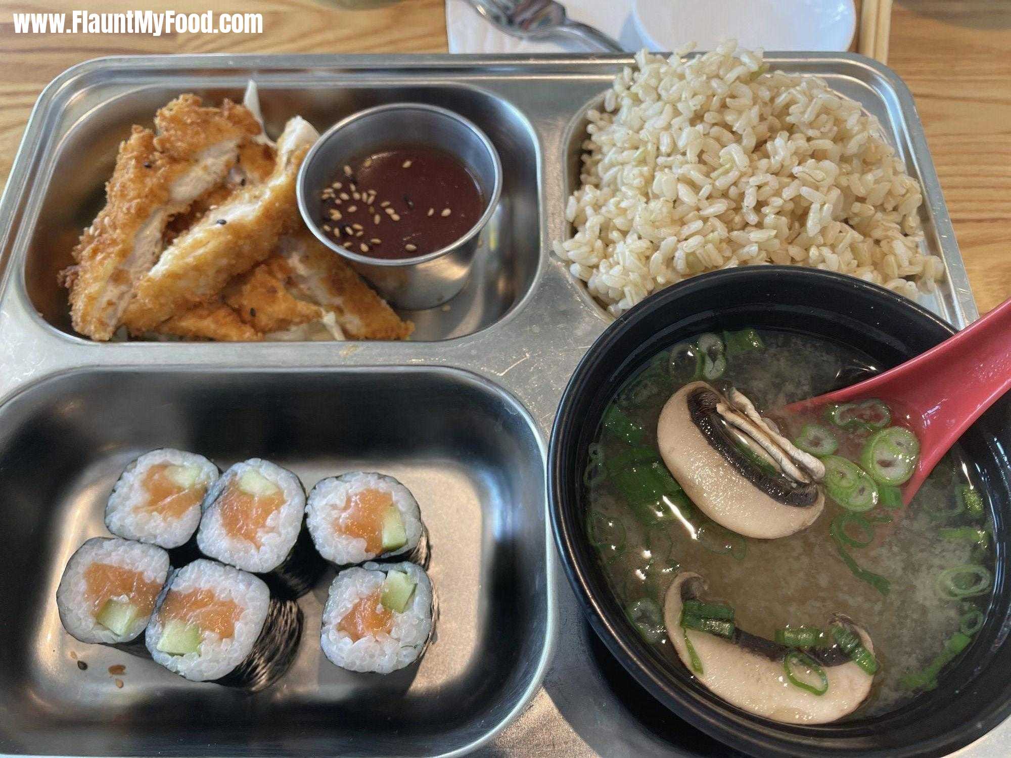 Tokyo Café off Camp, Bowie Boulevard in Fort Worth, TexasMiso soup along with various other sushi and brown rice and sesame seed, chicken and warm sake.