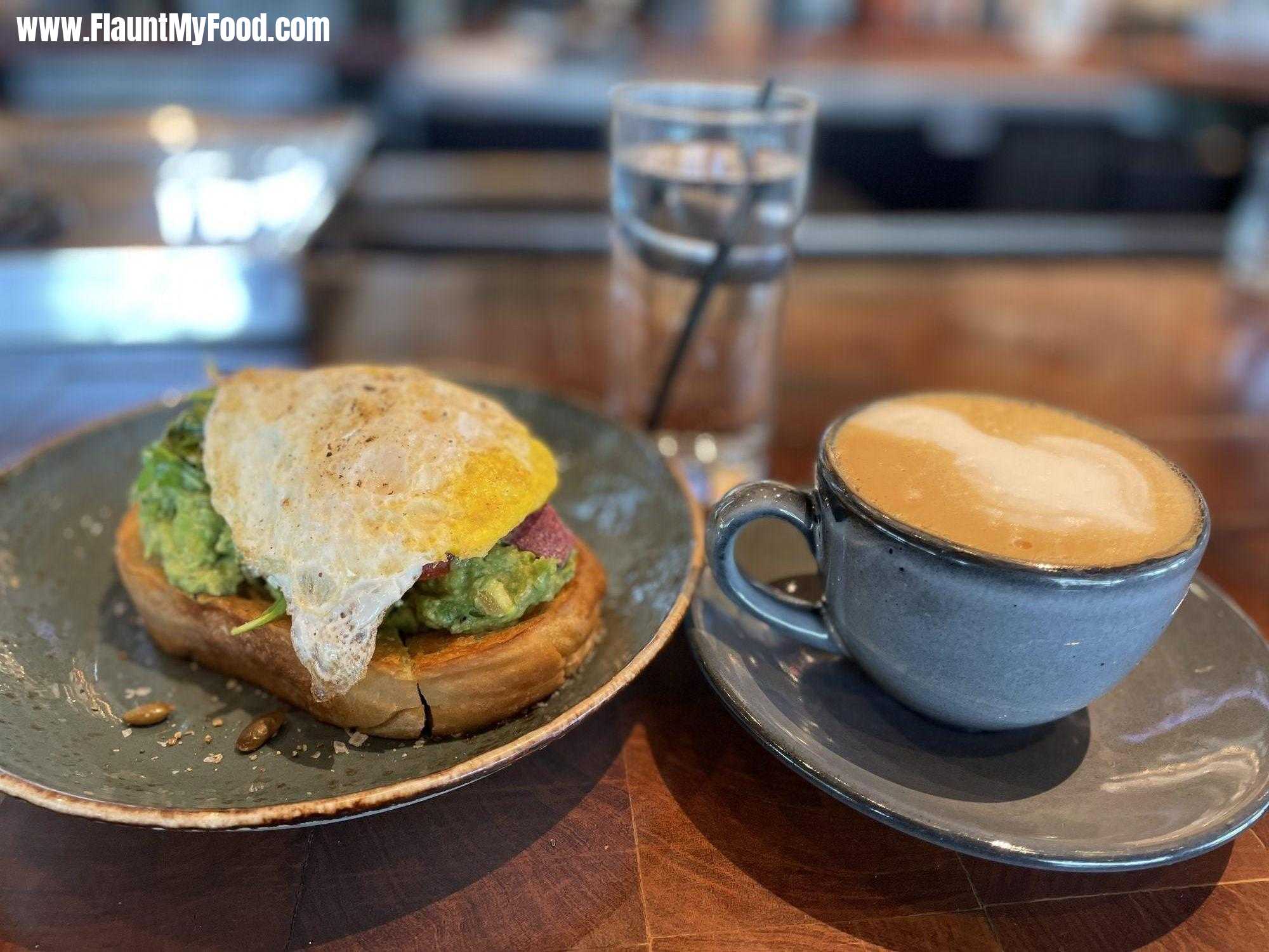 Avocado Toast with an Egg over Hard and a Decaf Latte at Press Cafe in Clearfork Fort Worth TexasAvocado Toast with an Egg over Hard and a Decaf Latte at Press Cafe in Clearfork Fort Worth Texas
