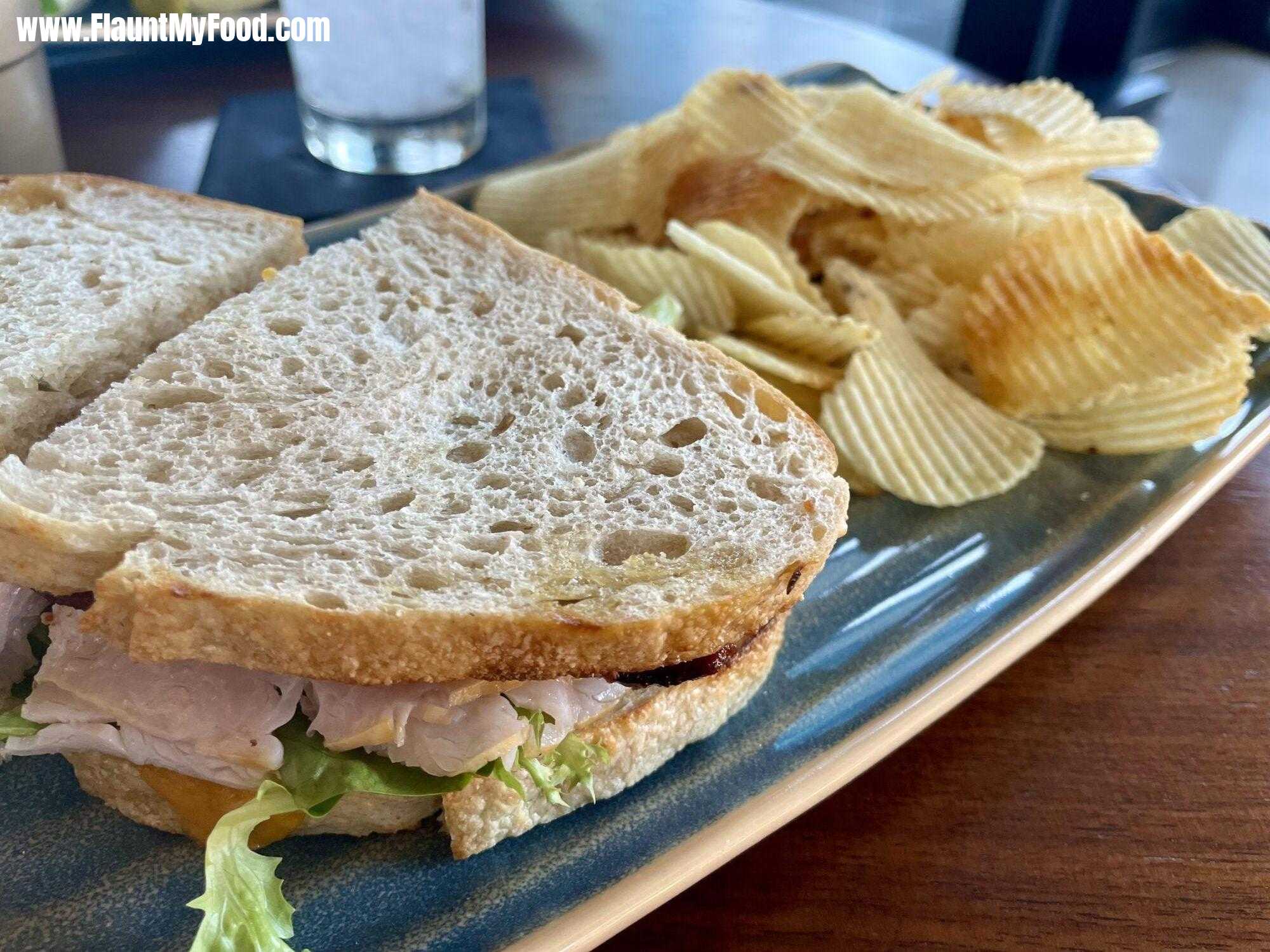 Lunch at branch and Bird downtown Fort Worth, TexasTurkey club sandwich with chips and various dips at Branchburg in downtown Fort Worth Texas on the 12th floor restaurant has a nice view of the city.