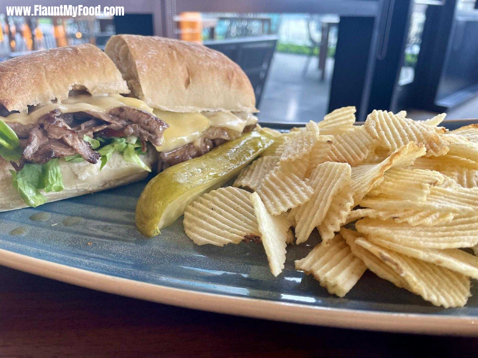 Ribeye sandwich at Branchton Bird restaurant downtown Fort Worth, TexasRibeye sandwich with chips, branch and bird downtown Fort Worth, Texas